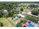 A high angle of the home, pool and a nearby lake and neighborhood at 8513 Heister St, Punta Gorda, FL 33982