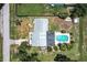 Overhead shot showcasing the property's roof, pool, and surrounding neighborhood streets at 8513 Heister St, Punta Gorda, FL 33982
