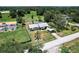 Aerial view capturing the home's facade, carport, surroundings, and nearby home at 8513 Heister St, Punta Gorda, FL 33982