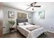 This cozy bedroom features a ceiling fan and pleasant decor at 8513 Heister St, Punta Gorda, FL 33982
