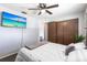 This bedroom features a closet and TV for easy viewing at 8513 Heister St, Punta Gorda, FL 33982