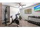 This is an exercise room with weights, a spin bike, and a TV at 8513 Heister St, Punta Gorda, FL 33982