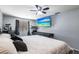 Well-lit main bedroom featuring a mounted TV, neutral decor, and a comfortable king-size bed at 8513 Heister St, Punta Gorda, FL 33982