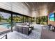 Cozy screened lanai with comfortable seating overlooking a refreshing pool and tropical landscaping at 8513 Heister St, Punta Gorda, FL 33982