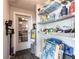 This storage area features shelves, a water heater, and an exterior door at 8513 Heister St, Punta Gorda, FL 33982