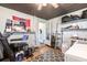 Well-lit utility room featuring sports memorabilia, storage shelves, and essential cleaning equipment for efficient household management at 8513 Heister St, Punta Gorda, FL 33982