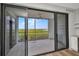 Spacious balcony featuring a ceiling fan and offering beautiful views of the surrounding nature at 900 E Marion Ave # 1203, Punta Gorda, FL 33950