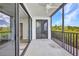 Private balcony with scenic views of the surrounding greenery and clear skies at 900 E Marion Ave # 1203, Punta Gorda, FL 33950