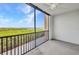 Balcony with a ceiling fan offers picturesque views of the lush surroundings and waterways at 900 E Marion Ave # 1203, Punta Gorda, FL 33950