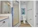 Clean bathroom featuring walk-in shower, toilet, and a vanity with marble countertop at 900 E Marion Ave # 1203, Punta Gorda, FL 33950