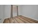 Bright bedroom with hardwood floors, and window offering natural light at 900 E Marion Ave # 1203, Punta Gorda, FL 33950