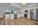A modern kitchen with wood floors and stainless steel appliances with beautiful water view at 900 E Marion Ave # 1203, Punta Gorda, FL 33950