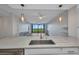 A spacious kitchen with granite countertops, stainless steel appliances and water view at 900 E Marion Ave # 1203, Punta Gorda, FL 33950