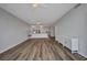 Open-concept living room with stylish wood-look floors and ample natural light at 900 E Marion Ave # 1203, Punta Gorda, FL 33950