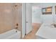 Bathroom featuring vanity with marble countertop, faucet and step-in shower at 10478 Coquina Ct, Placida, FL 33946