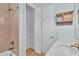 Bathroom featuring vanity with marble countertop, step-in shower and linen closet at 10478 Coquina Ct, Placida, FL 33946