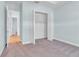 Neutral bedroom with plush carpeting and an open closet at 10478 Coquina Ct, Placida, FL 33946