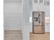 Stainless steel refrigerator next to the pantry with wire shelving, in this kitchen at 10478 Coquina Ct, Placida, FL 33946