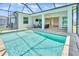 The backyard features a pool with screened lanai, providing serene outdoor living at 10478 Coquina Ct, Placida, FL 33946