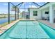Gorgeous pool with a screened lanai overlooking the pond at 10478 Coquina Ct, Placida, FL 33946