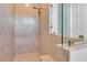 Tiled shower with shower head and glass partition at 10478 Coquina Ct, Placida, FL 33946