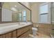 Modern bathroom with a long sink and walk-in shower at 1323 Mineo Dr, Punta Gorda, FL 33950