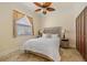 Well-lit bedroom with travertine flooring and a closet at 1323 Mineo Dr, Punta Gorda, FL 33950