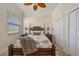 Well-lit bedroom with travertine flooring and a closet at 1323 Mineo Dr, Punta Gorda, FL 33950