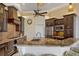 Gourmet kitchen featuring granite countertops, stainless steel appliances, and dark wood cabinetry at 1323 Mineo Dr, Punta Gorda, FL 33950