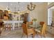 Beautiful kitchen with seating, island, and view of the dining area with seating for six at 1323 Mineo Dr, Punta Gorda, FL 33950