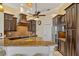 Gourmet kitchen with granite countertops, custom cabinetry, and stainless steel appliances at 1323 Mineo Dr, Punta Gorda, FL 33950