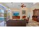 Bright living room with views of the backyard pool, stylish furnishings, and contemporary decor at 1323 Mineo Dr, Punta Gorda, FL 33950