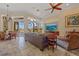 Open living space with dining area and pool views, featuring large windows and stylish furnishings at 1323 Mineo Dr, Punta Gorda, FL 33950