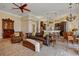 Spacious living room flowing into a kitchen and dining area with stylish leather furniture at 1323 Mineo Dr, Punta Gorda, FL 33950
