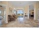 Spacious living room with travertine flooring and a large window overlooking the outdoor area at 1323 Mineo Dr, Punta Gorda, FL 33950