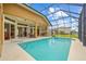 Inviting screened-in pool area with outdoor seating and access to indoor entertaining areas at 1323 Mineo Dr, Punta Gorda, FL 33950