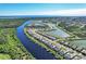 Stunning aerial view of a waterfront community with canals, lakes, and beautiful landscaping at 14436 Ponce De Leon Trl, Port Charlotte, FL 33981