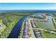 Aerial view of waterfront homes and community featuring winding canals and lush green landscaping at 14436 Ponce De Leon Trl, Port Charlotte, FL 33981
