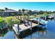 Beautiful waterfront homes with private docks, boat lifts, and inviting outdoor seating areas with picturesque water access and views at 14436 Ponce De Leon Trl, Port Charlotte, FL 33981