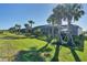 Spacious backyard features tropical landscaping, a screened enclosure, and a private dock that offers direct water access at 14436 Ponce De Leon Trl, Port Charlotte, FL 33981