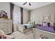 Cozy bedroom with twin beds, neutral walls, and carpet flooring at 14436 Ponce De Leon Trl, Port Charlotte, FL 33981
