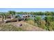 Waterfront property featuring a private boat dock with lift, providing direct access to the water and recreational opportunities at 14436 Ponce De Leon Trl, Port Charlotte, FL 33981