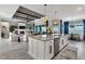 Open kitchen with granite countertops, stainless appliances, and seamless flow to the living room at 14436 Ponce De Leon Trl, Port Charlotte, FL 33981