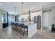 Spacious kitchen island with seating, stainless appliances, granite countertops, and tile flooring at 14436 Ponce De Leon Trl, Port Charlotte, FL 33981