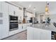 This modern kitchen offers granite countertops, stainless appliances, and a tile backsplash at 14436 Ponce De Leon Trl, Port Charlotte, FL 33981