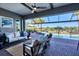 Relaxing screened-in patio with comfortable seating overlooking the pool and lush landscaping at 14436 Ponce De Leon Trl, Port Charlotte, FL 33981
