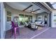 Spacious outdoor patio with comfortable seating, perfect for entertaining with beautiful patio accents at 14436 Ponce De Leon Trl, Port Charlotte, FL 33981
