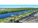 Expansive waterfront view featuring private docks and screened-in pool areas, perfect for outdoor living at 14436 Ponce De Leon Trl, Port Charlotte, FL 33981
