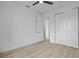 Neutral bedroom with sliding closet door, ceiling fan and luxury vinyl flooring at 17156 Eugene Ave, Port Charlotte, FL 33954