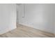 Bright bedroom features a door and light wood-look flooring at 17156 Eugene Ave, Port Charlotte, FL 33954